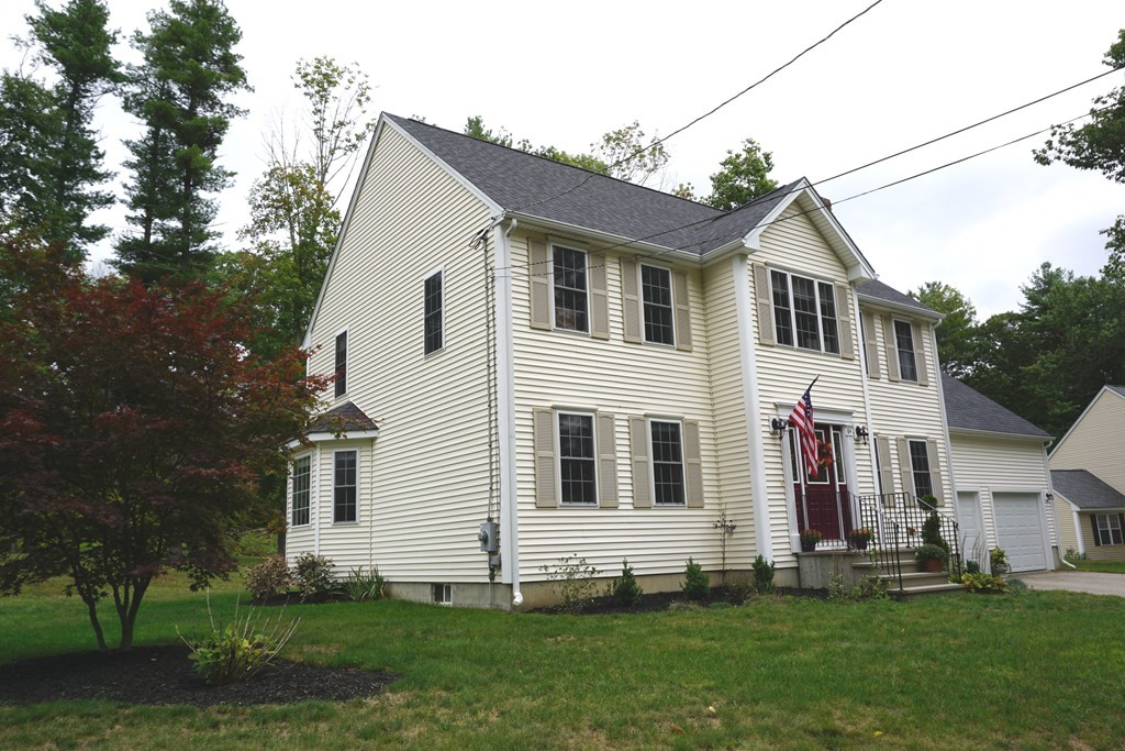 84 Fairview Park Road Sturbridge, MA 01566 - Photo 26 of 30 a front view of a house with a yard