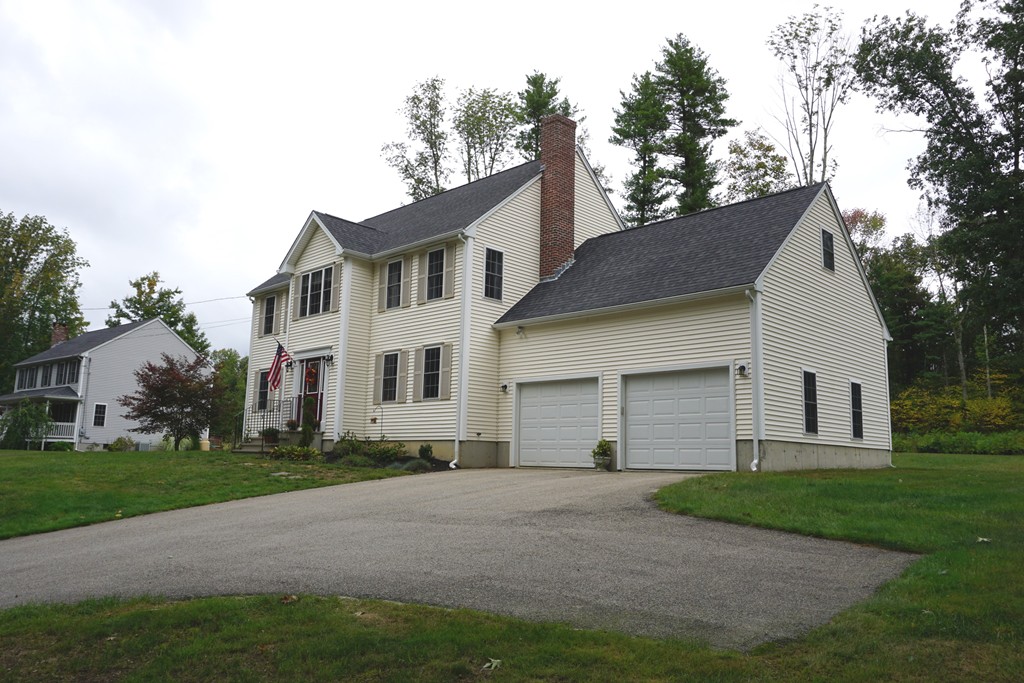 84 Fairview Park Road Sturbridge, MA 01566 - Photo 30 of 30 a front view of a house with a yard and trees