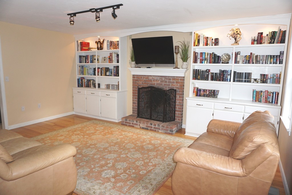 84 Fairview Park Road Sturbridge, MA 01566 - Photo 3 of 30 a living room with furniture a flat screen tv and a fireplace