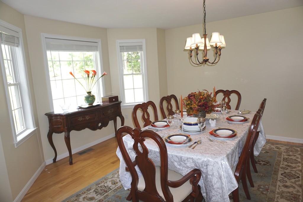 84 Fairview Park Road Sturbridge, MA 01566 - Photo 7 of 30 a view of a dining room with furniture a chandelier and a window