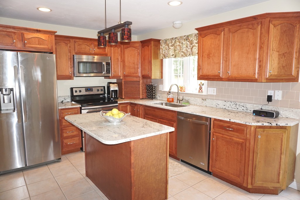 84 Fairview Park Road Sturbridge, MA 01566 - Photo 10 of 30 a kitchen with stainless steel appliances granite countertop a sink a refrigerator and a stove