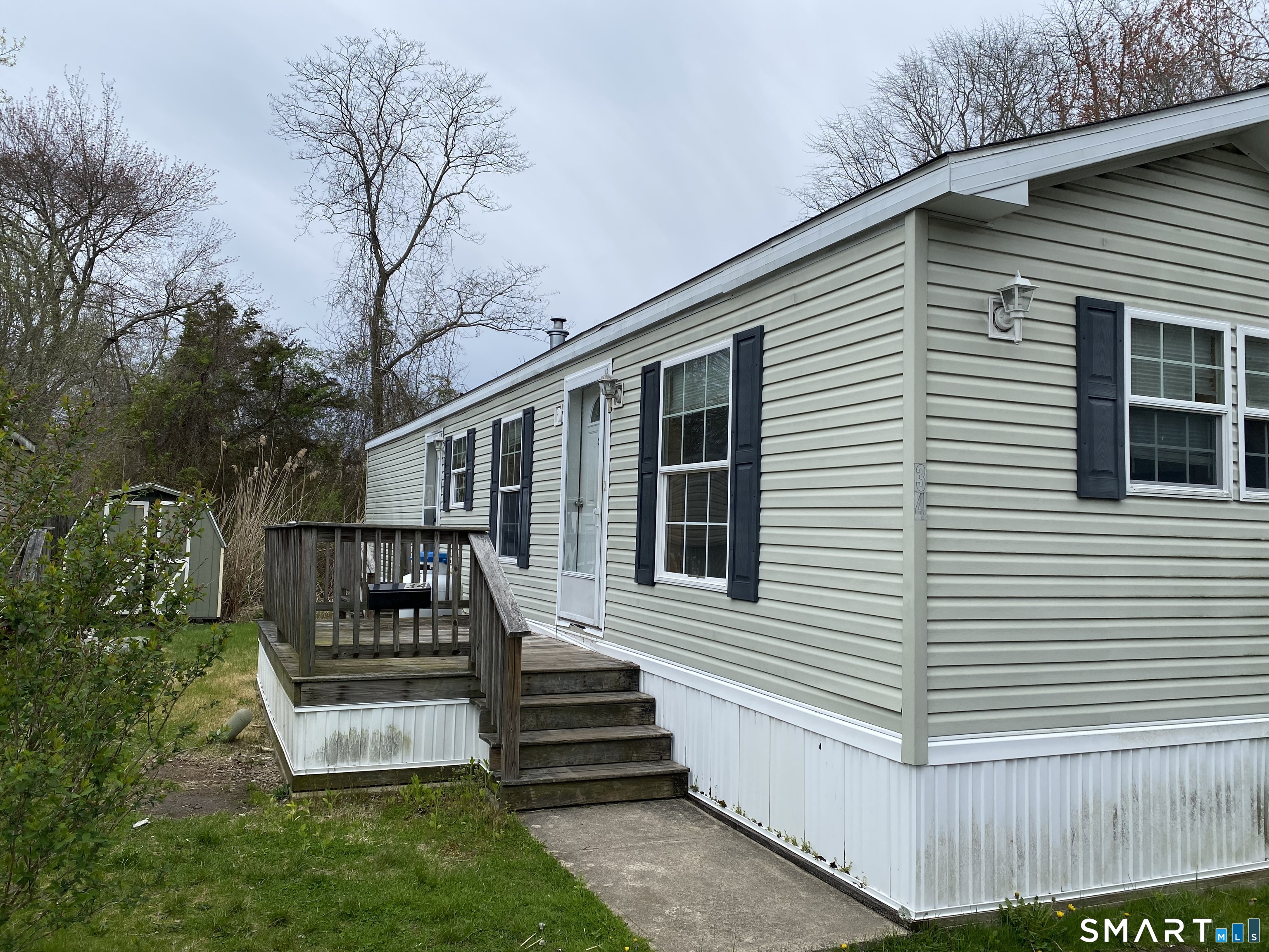 34 Terrace Drive Waterford, CT 06385 - Photo 1 of 8 a view of a house with a yard and wooden fence