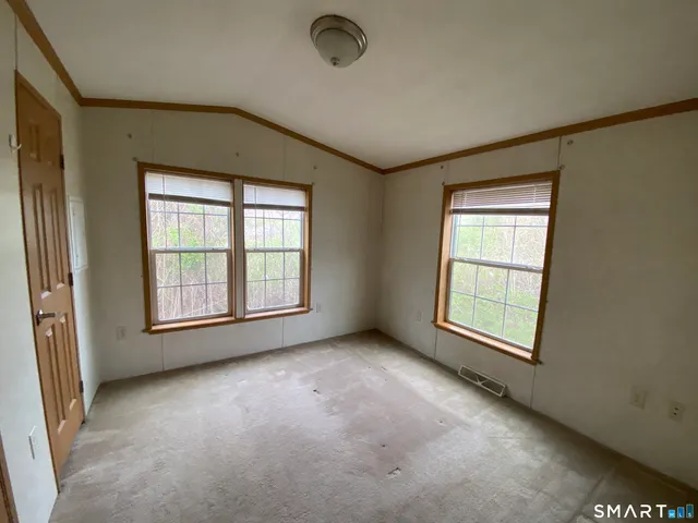 an empty room with windows