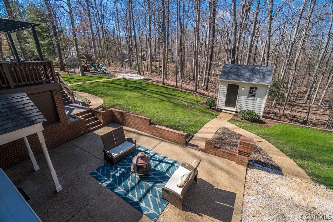 14300 West Salisbury Road Midlothian, VA 23113 - Photo 20 of 50 a view of backyard with seating space and trees