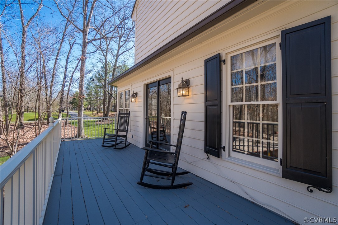 14300 West Salisbury Road Midlothian, VA 23113 - Photo 24 of 50 a view of a deck with a table and chairs with wooden floor and fence