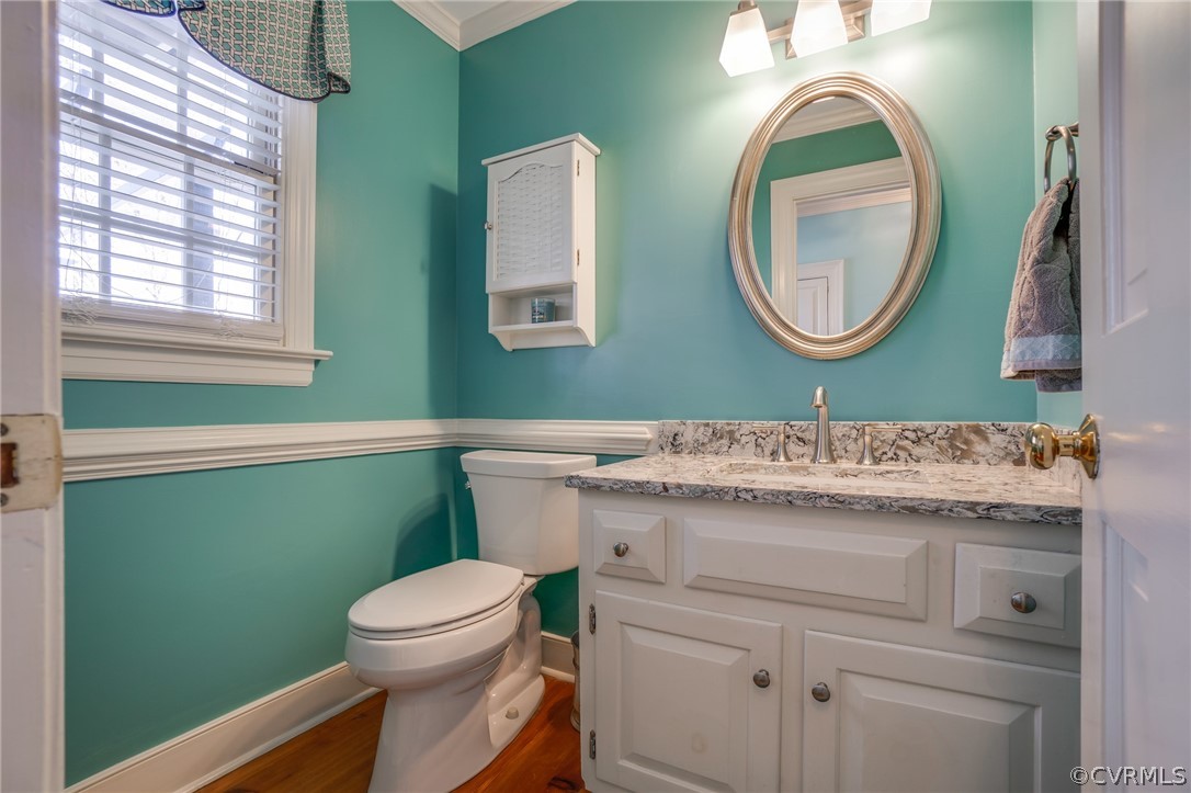 14300 West Salisbury Road Midlothian, VA 23113 - Photo 25 of 50 a bathroom with a toilet sink vanity and mirror