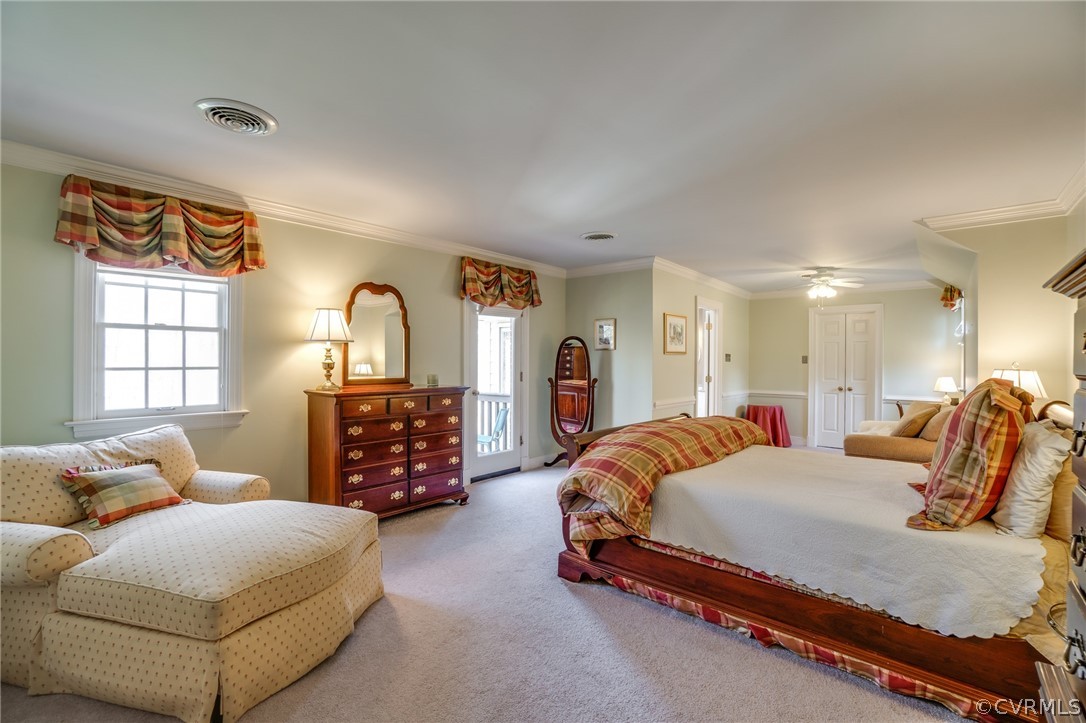 14300 West Salisbury Road Midlothian, VA 23113 - Photo 26 of 50 a spacious bedroom with a bed a dresser and mirror