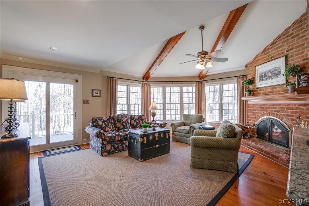 14300 West Salisbury Road Midlothian, VA 23113 - Photo 6 of 50 a living room with furniture a fireplace and large windows