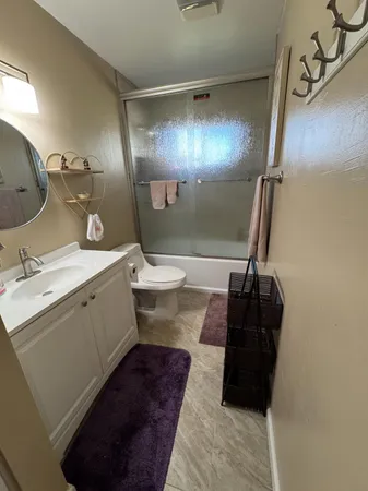 a bathroom with a sink and mirror