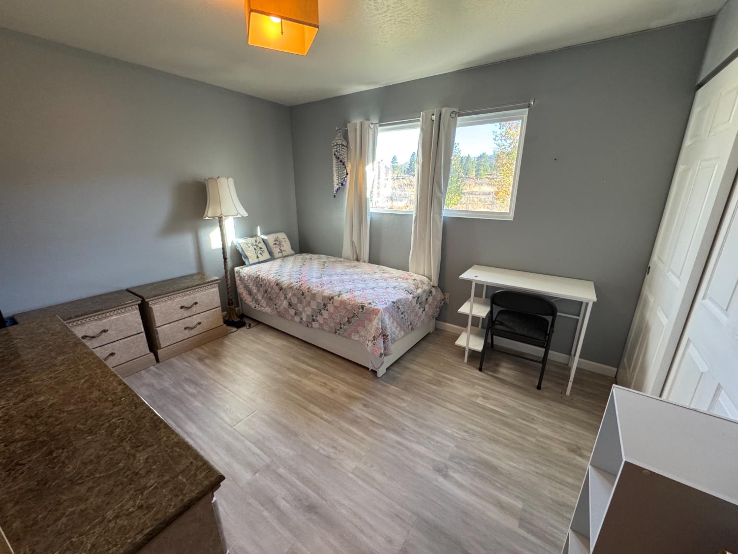 100 Patterson Avenue Loyalton, CA 96118 - Photo 13 of 36 a bedroom with a bed and a night stand