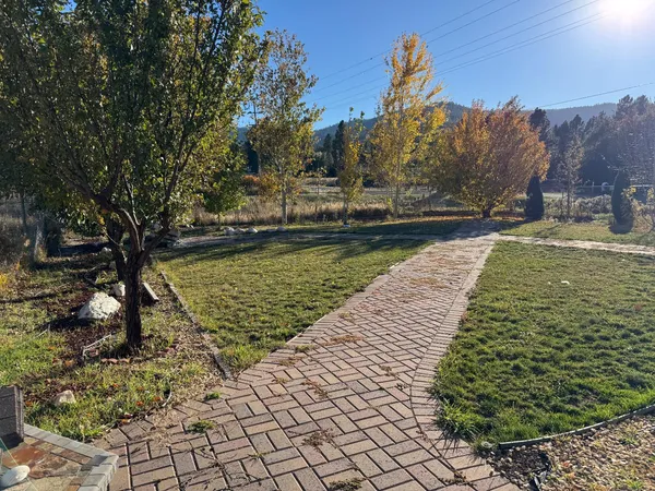 a view of a yard with an outdoor seating