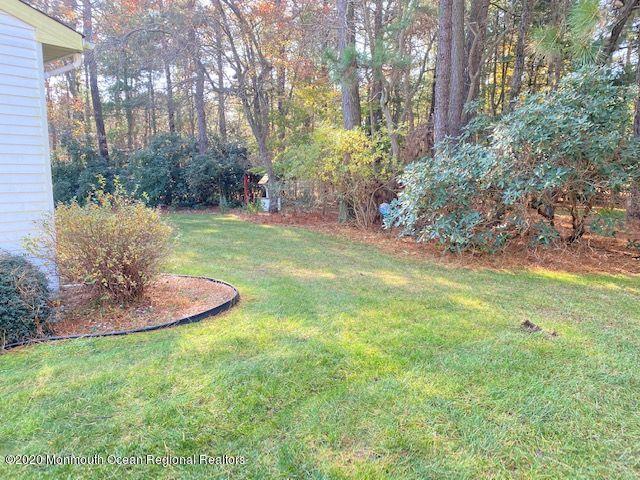 136 B Sunset Road Whiting, NJ 08759 - Photo 2 of 16 a view of a backyard with large trees