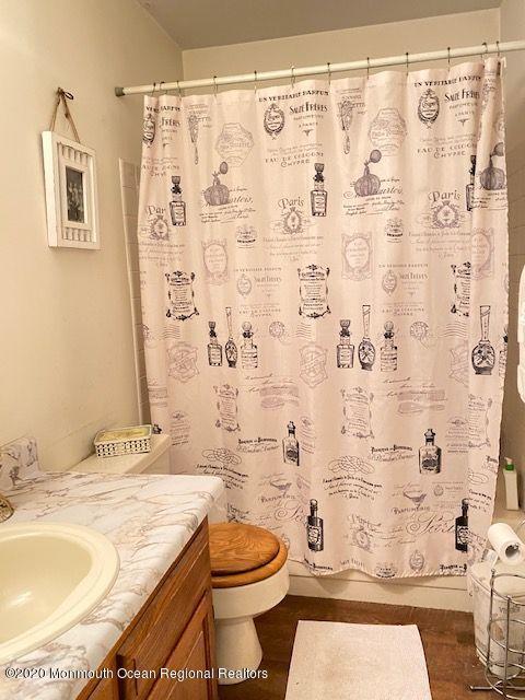 136 B Sunset Road Whiting, NJ 08759 - Photo 11 of 16 a bathroom with a granite countertop toilet sink and shower