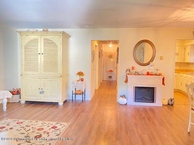 136 B Sunset Road Whiting, NJ 08759 - Photo 5 of 16 a view of a livingroom with furniture and a fireplace