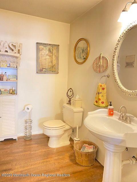 136 B Sunset Road Whiting, NJ 08759 - Photo 9 of 16 a bathroom with a toilet and a sink