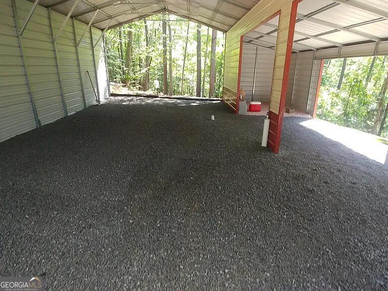 333 Venture Trail Sparta, GA 31087 - Photo 12 of 16 a view of empty room with floor to ceiling window