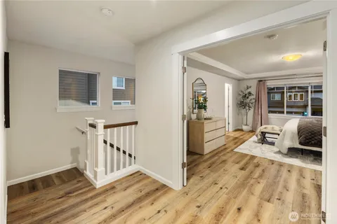 a bedroom with furniture and a window