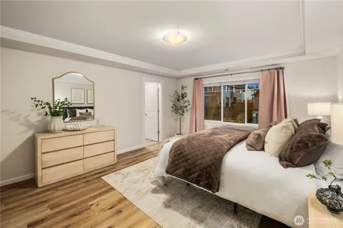 a bedroom with a bed and a dresser