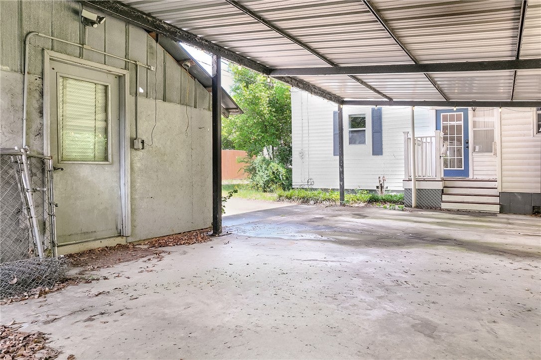 59 Church Street Notasulga, AL 36866 - Photo 38 of 38 This outdoor space offers convenient covered parking and a functional entry point to the property.