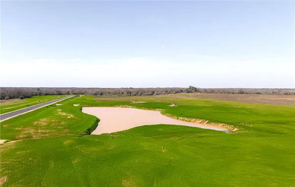 a view of roof with wooden floor and lake view