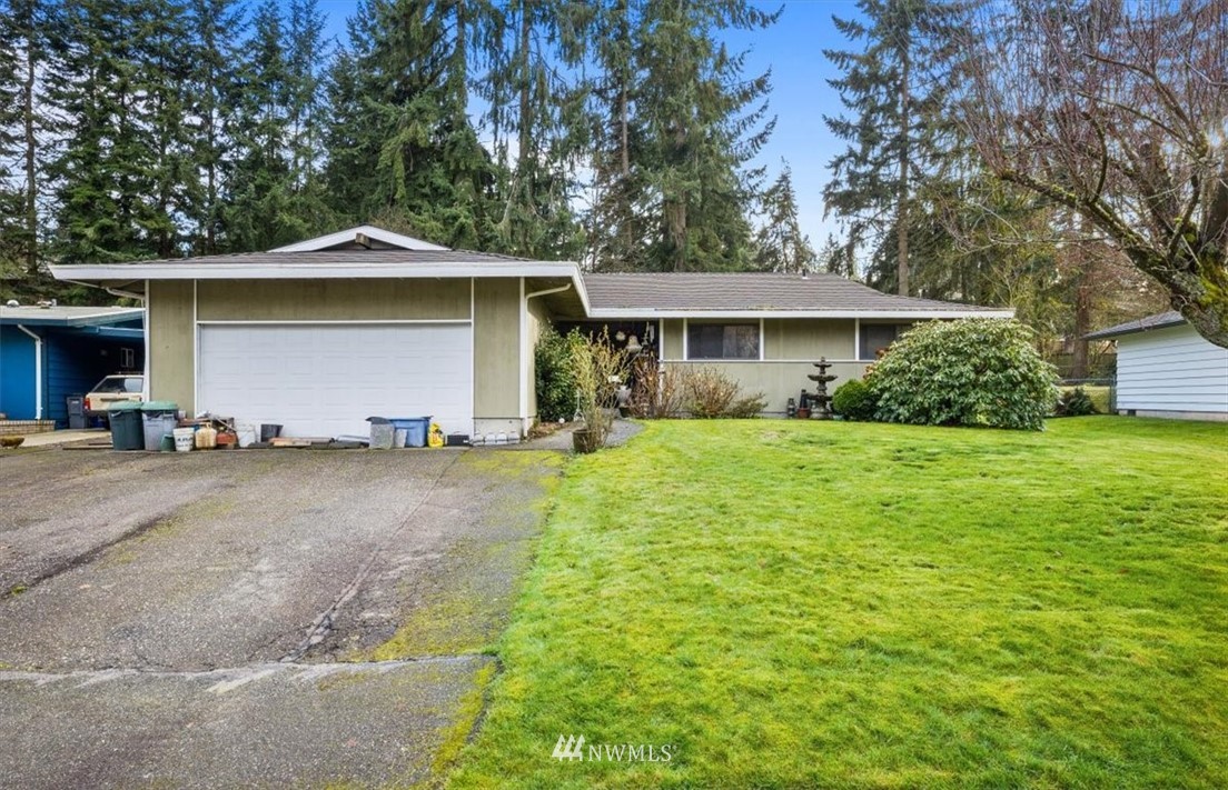 222 219th Place Southwest Bothell, WA 98021 - Photo 1 of 24 a view of a house with yard and plants