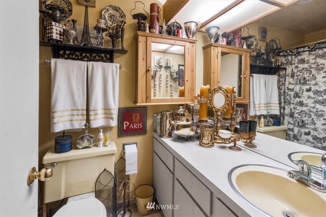 222 219th Place Southwest Bothell, WA 98021 - Photo 15 of 24 a bathroom with a sink mirror vanity and toilet