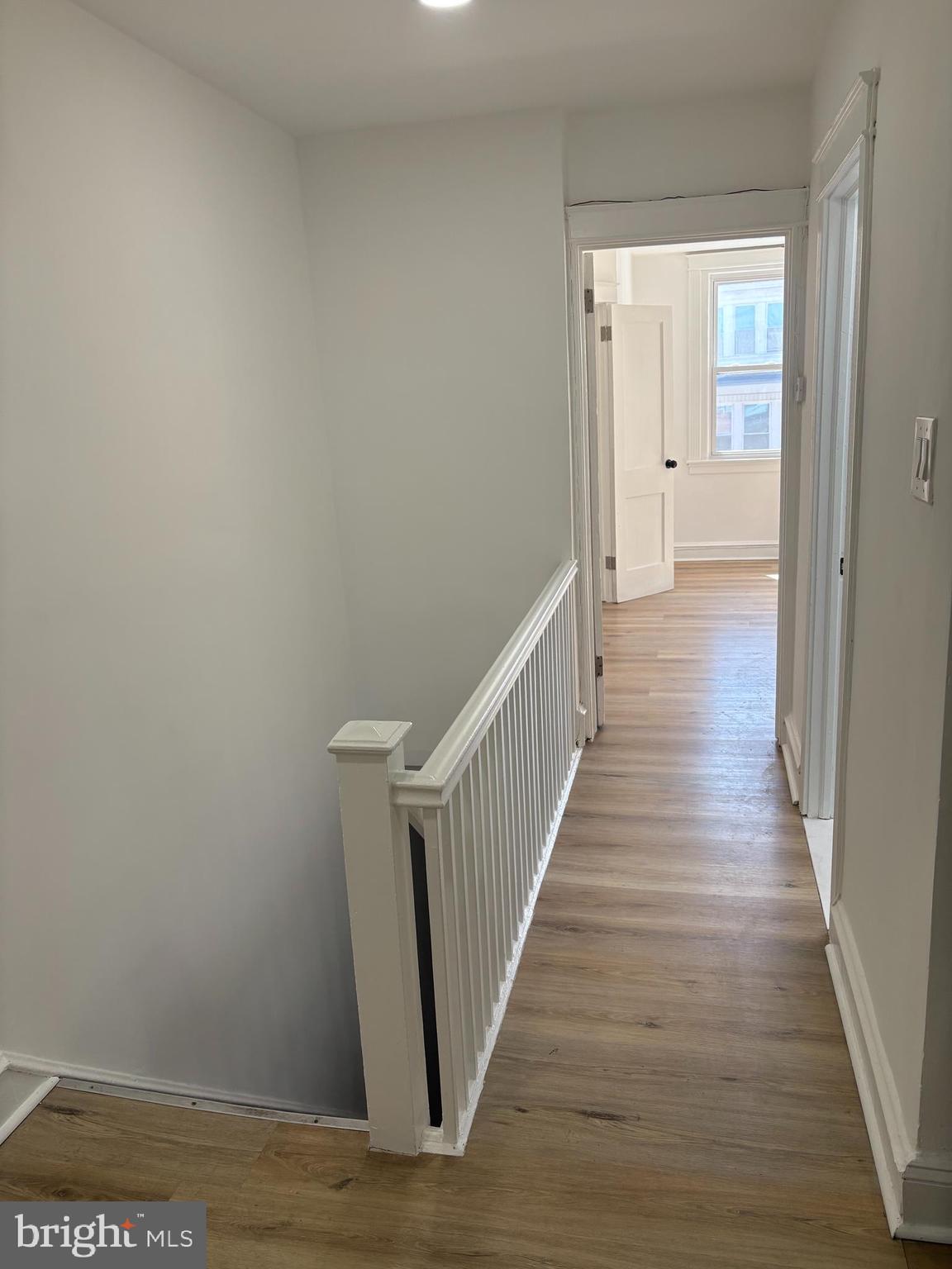 2111 North Wanamaker Street, Unit 2 Philadelphia, PA 19131 - Photo 3 of 10 a view of a hallway with wooden floor and staircase