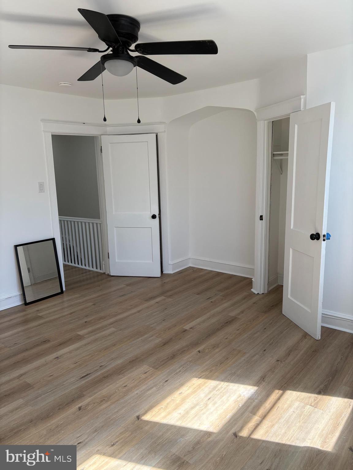 2111 North Wanamaker Street, Unit 2 Philadelphia, PA 19131 - Photo 4 of 10 a view of a room with wooden floor and white walls