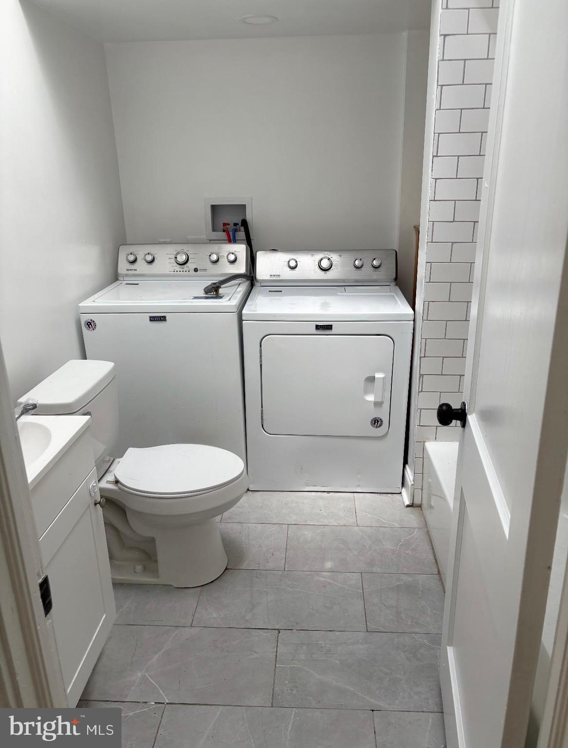 2111 North Wanamaker Street, Unit 2 Philadelphia, PA 19131 - Photo 5 of 10 a utility room with dryer and washer