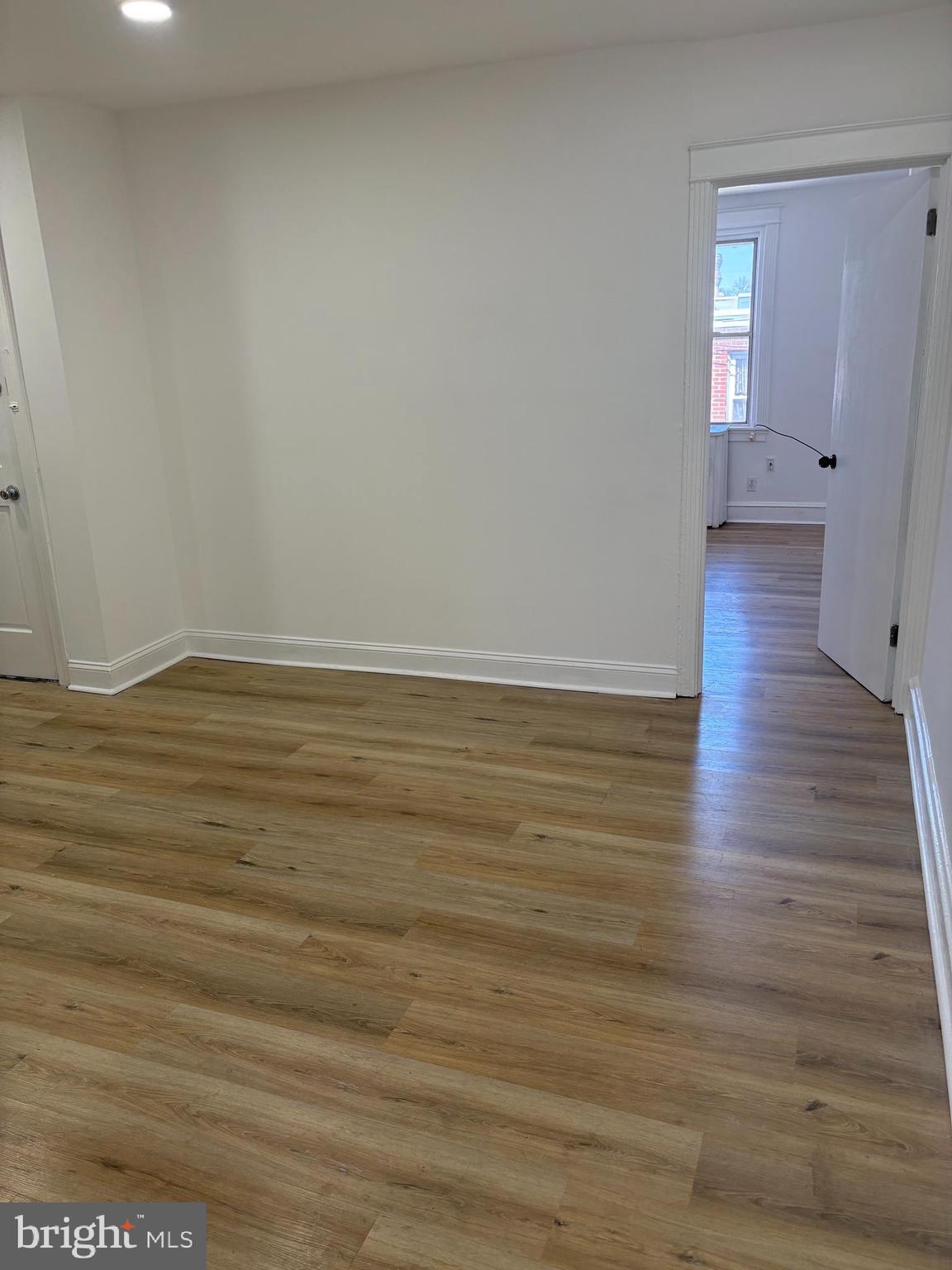 2111 North Wanamaker Street, Unit 2 Philadelphia, PA 19131 - Photo 8 of 10 a view of wooden floor and brick walls
