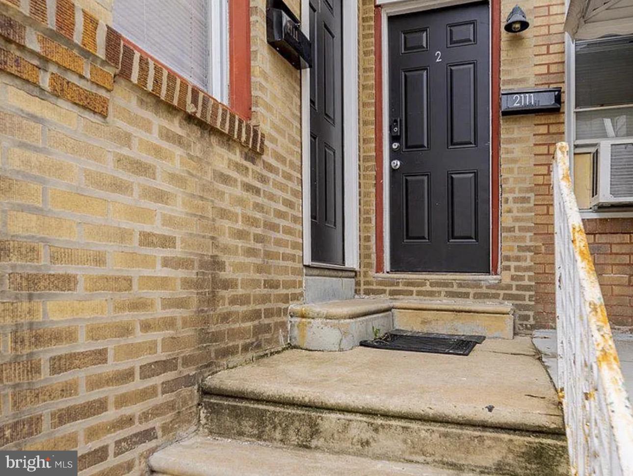 2111 North Wanamaker Street, Unit 2 Philadelphia, PA 19131 - Photo 10 of 10 a bathroom with a granite countertop sink and a mirror