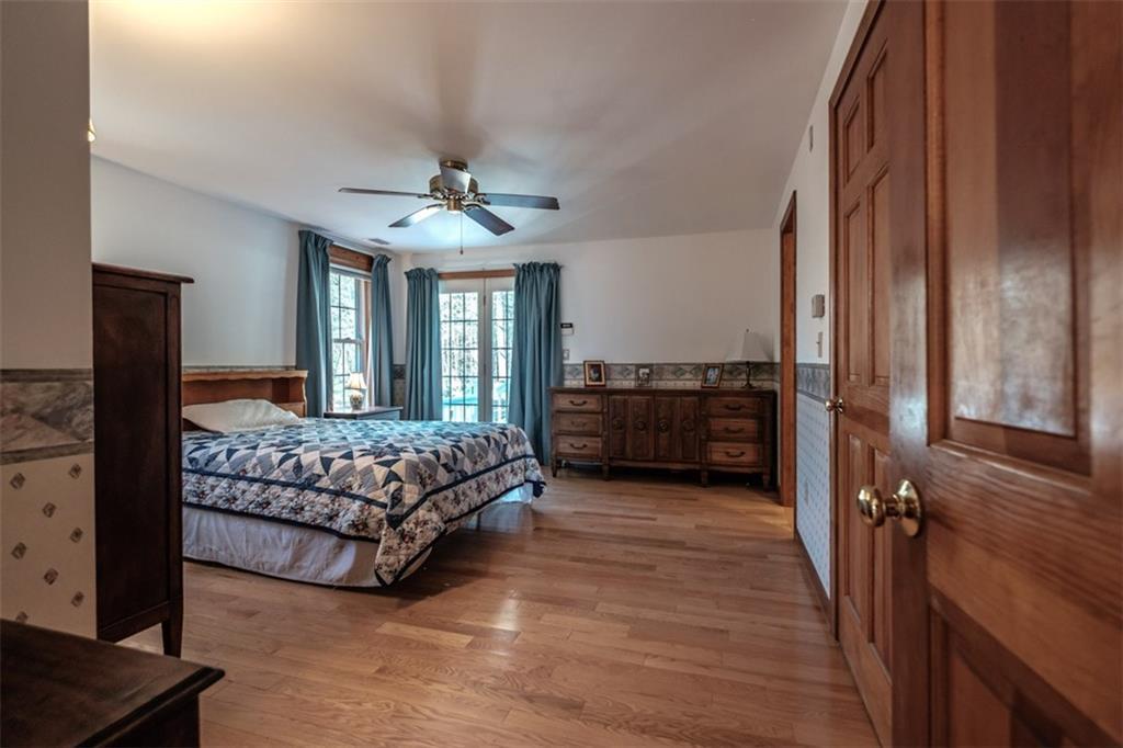 467 Walker Road Lyman, ME 04002 - Photo 13 of 34 Spacious master bedroom with doors...