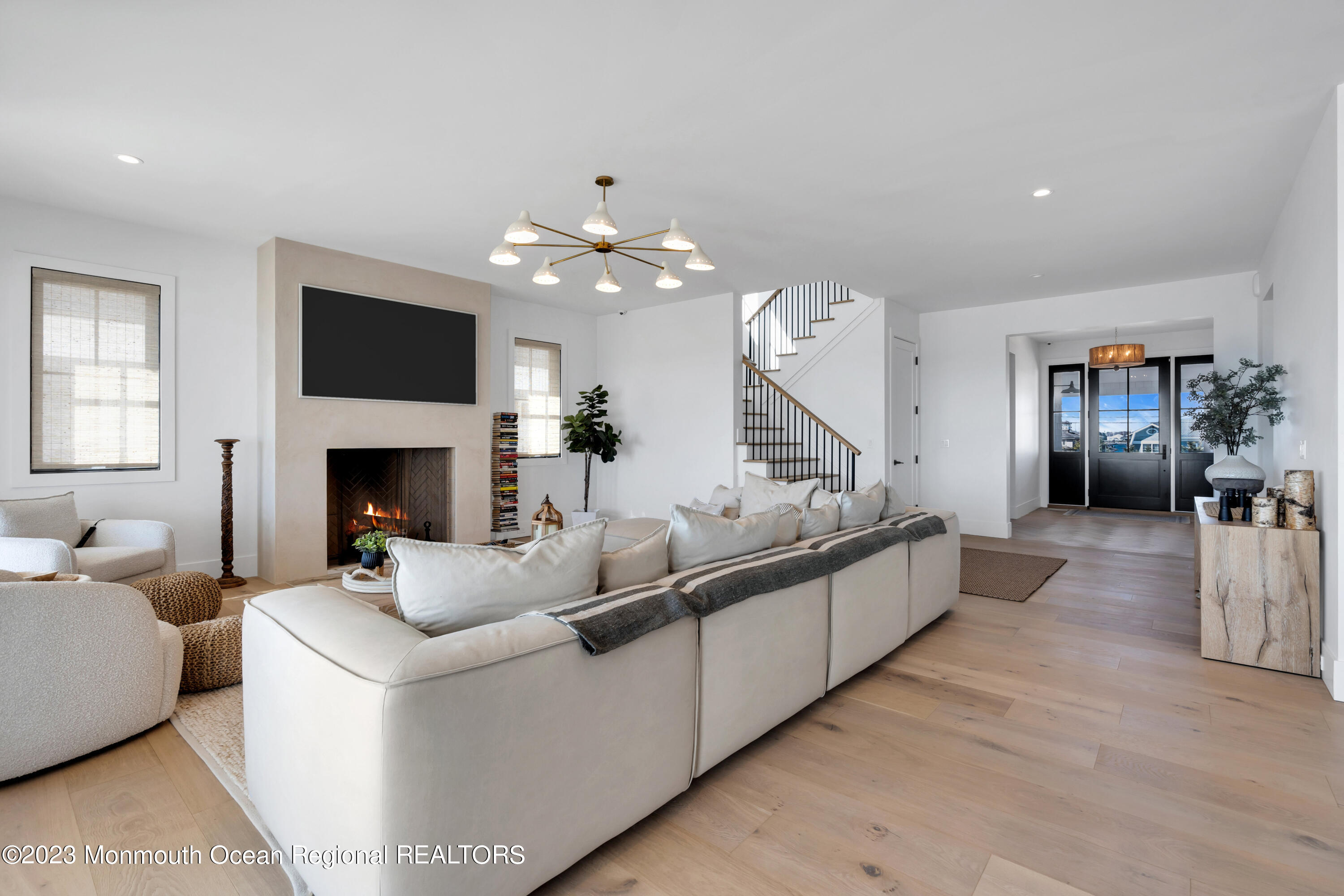 1125 North Ocean Avenue Mantoloking, NJ 08738 - Photo 13 of 69 a living room with furniture and a fireplace