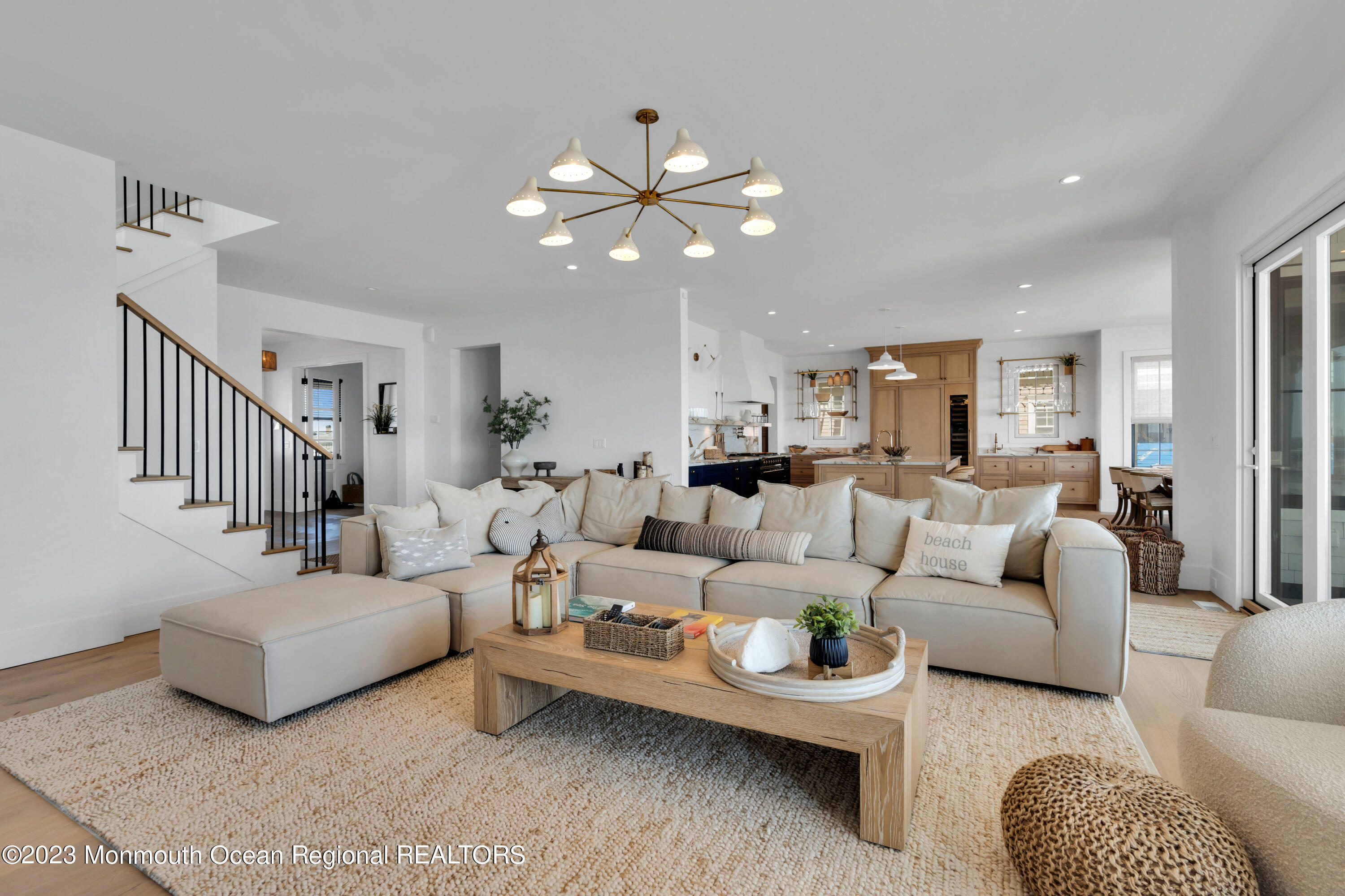 1125 North Ocean Avenue Mantoloking, NJ 08738 - Photo 14 of 69 a living room with furniture and a chandelier