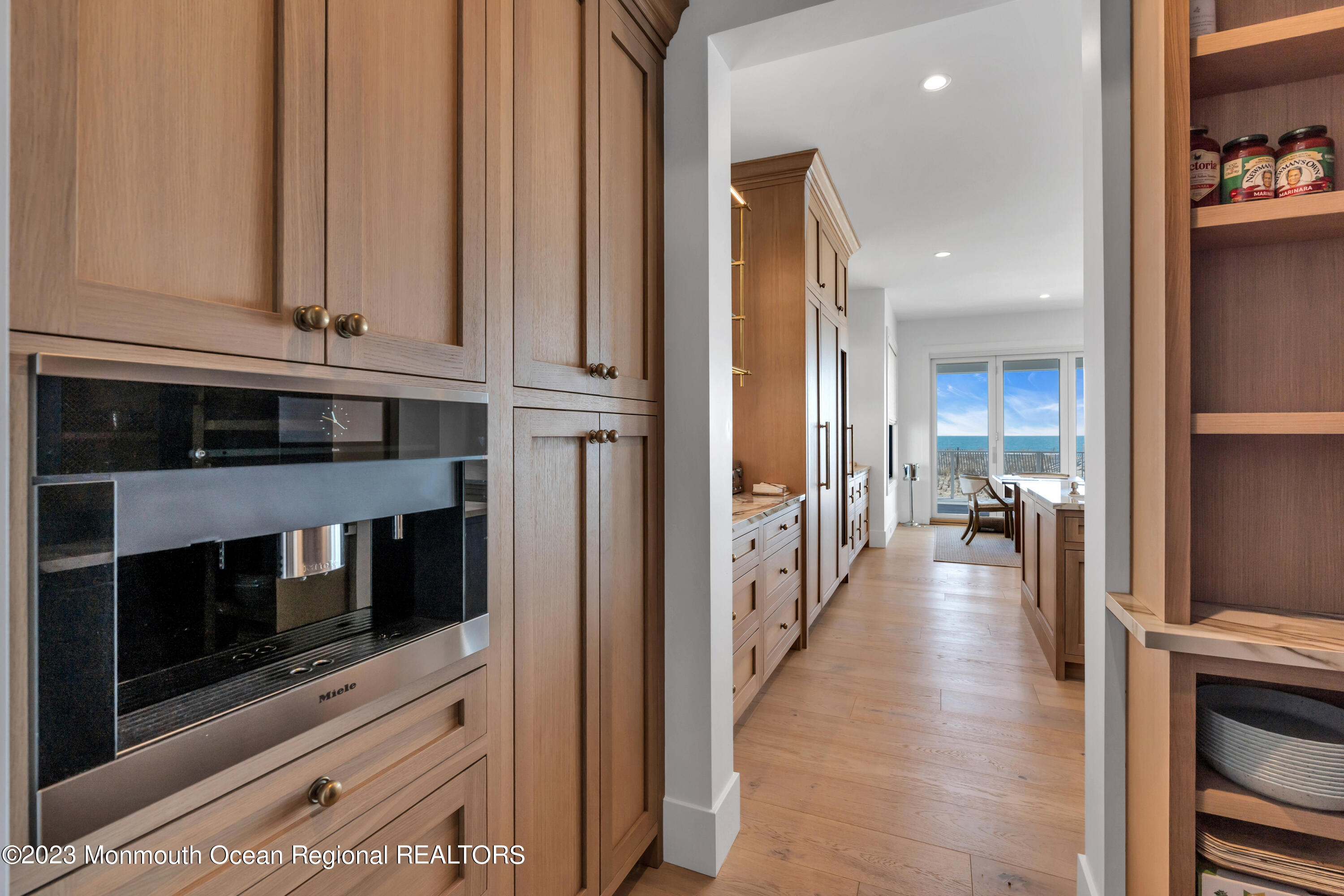 1125 North Ocean Avenue Mantoloking, NJ 08738 - Photo 20 of 69 a kitchen with stainless steel appliances granite countertop a stove and a microwave