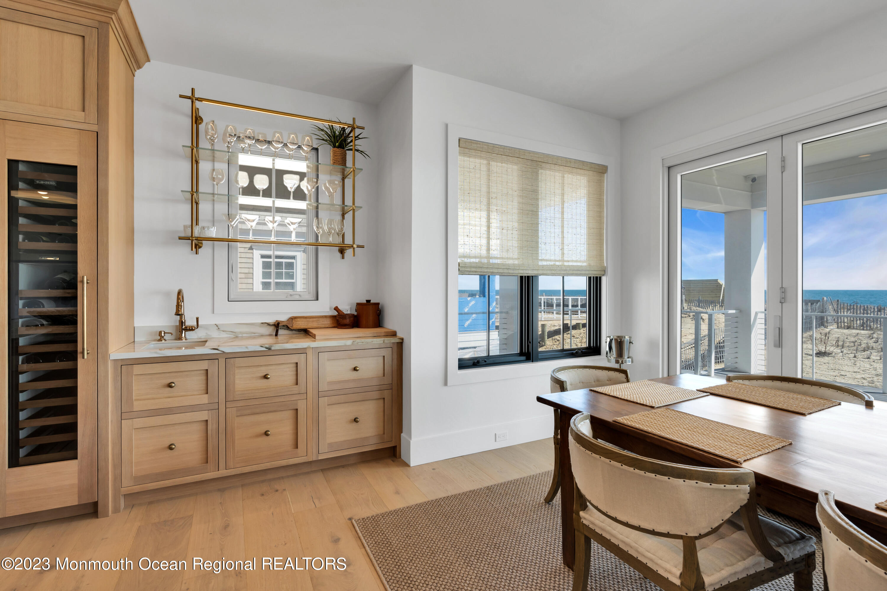 1125 North Ocean Avenue Mantoloking, NJ 08738 - Photo 21 of 69 a view of a dining room with furniture and windows