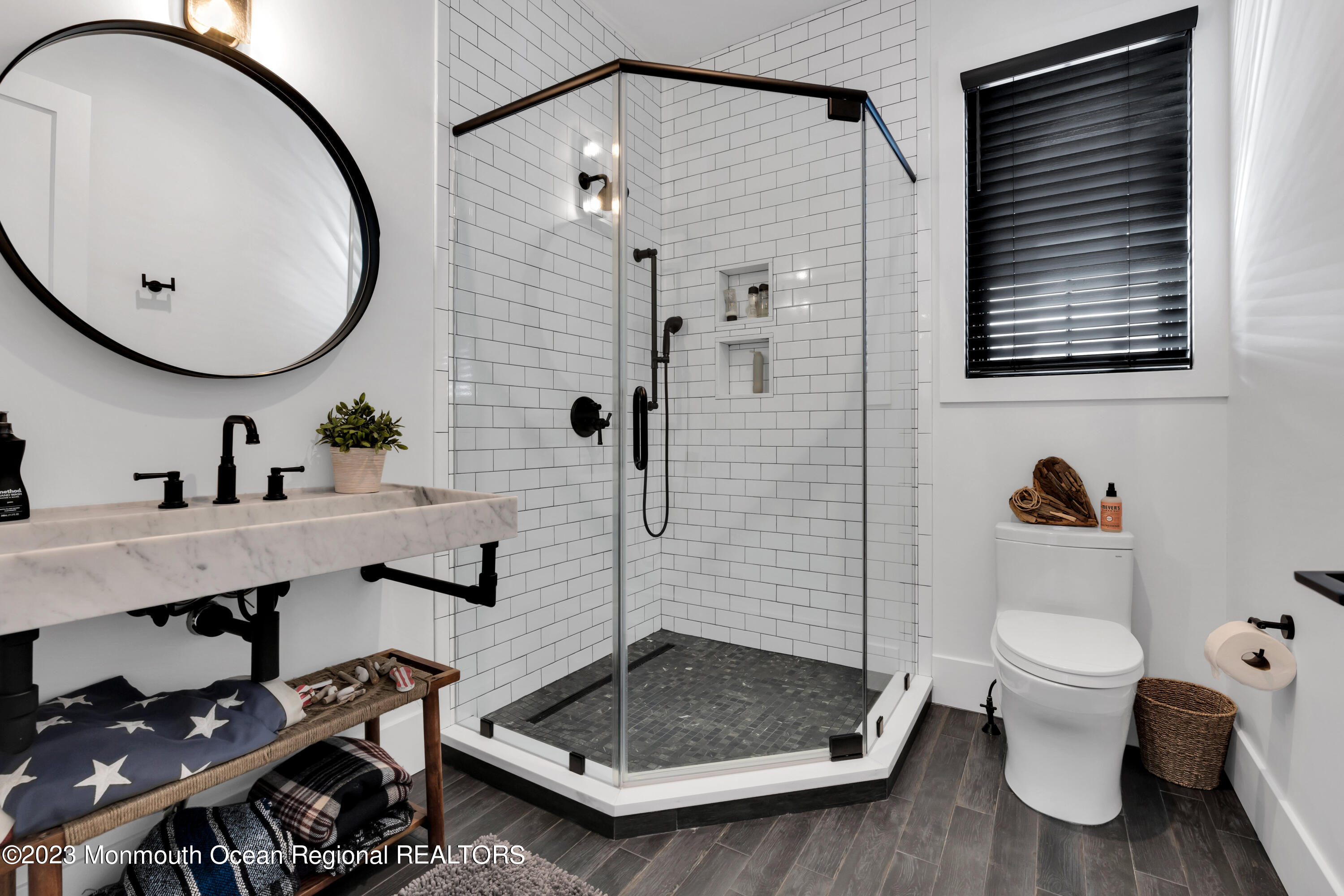 1125 North Ocean Avenue Mantoloking, NJ 08738 - Photo 27 of 69 a bathroom with a sink a toilet and a mirror