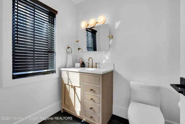 a utility room with sink dryer and washer