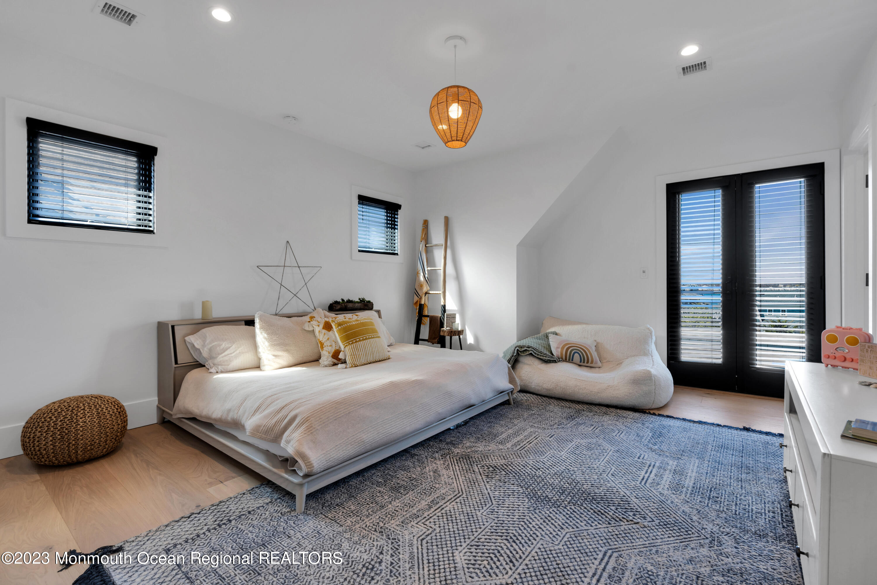 1125 North Ocean Avenue Mantoloking, NJ 08738 - Photo 41 of 69 a bedroom with bed and a couch