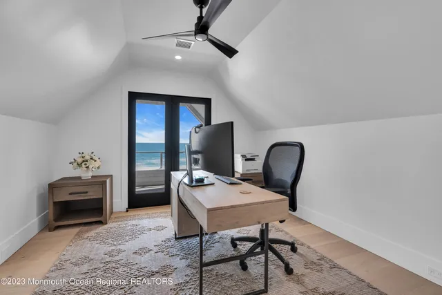 a view of a dry yard with a house in the background