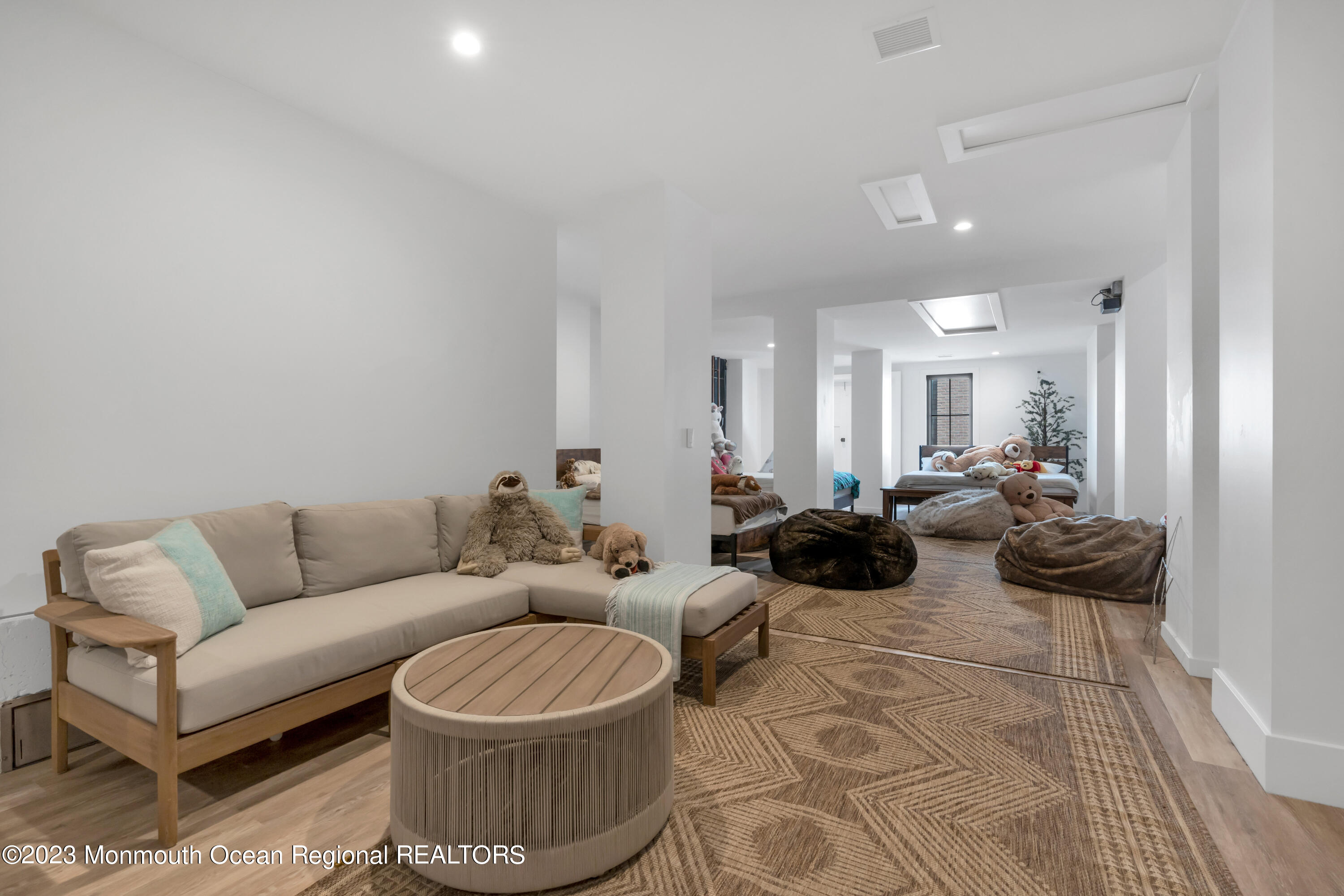 1125 North Ocean Avenue Mantoloking, NJ 08738 - Photo 56 of 69 a living room with furniture and a wooden floor