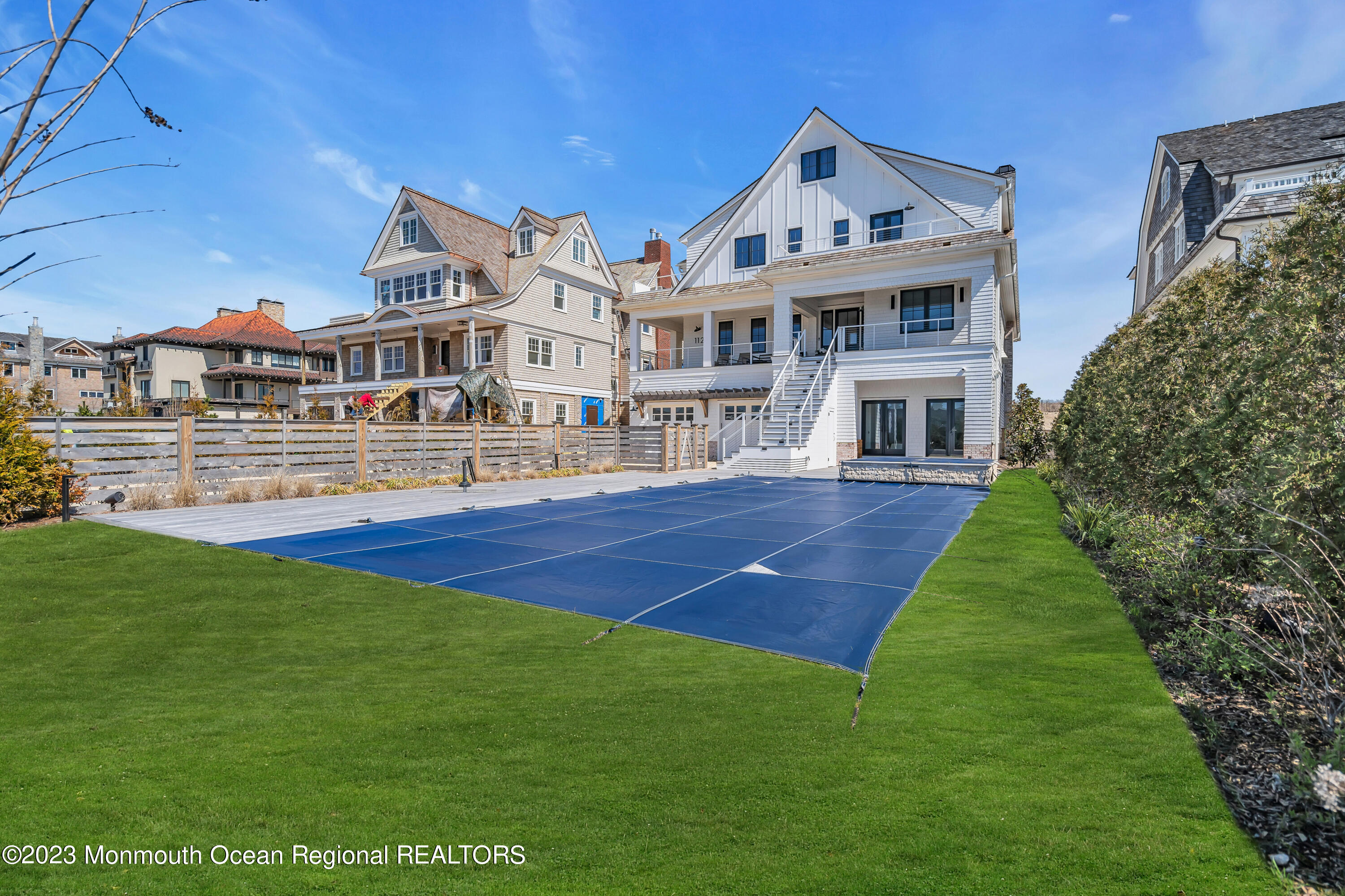 1125 North Ocean Avenue Mantoloking, NJ 08738 - Photo 59 of 69 a front view of a house with a garden