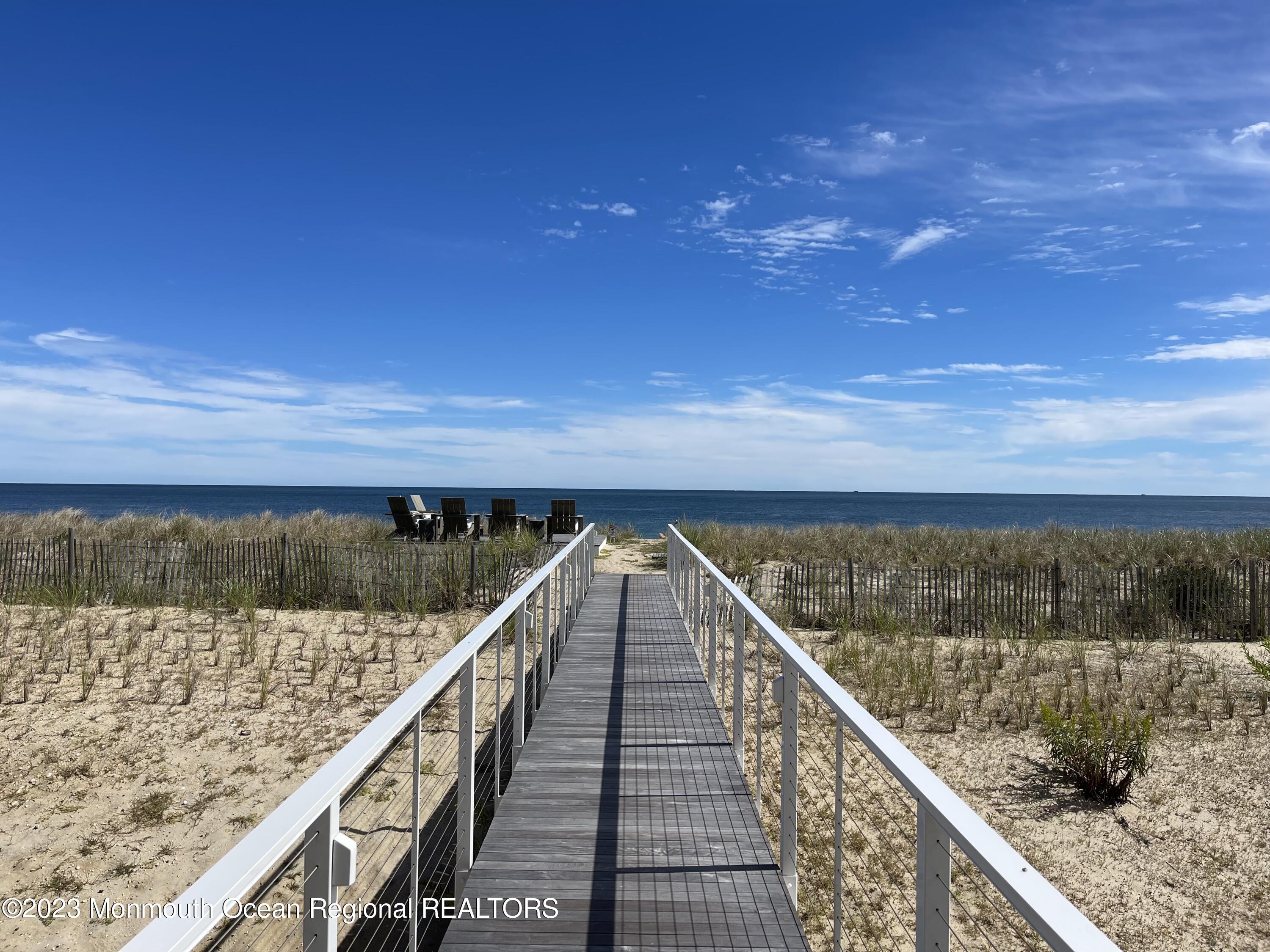 1125 North Ocean Avenue Mantoloking, NJ 08738 - Photo 65 of 69 a view of a balcony with wooden floor and lake view