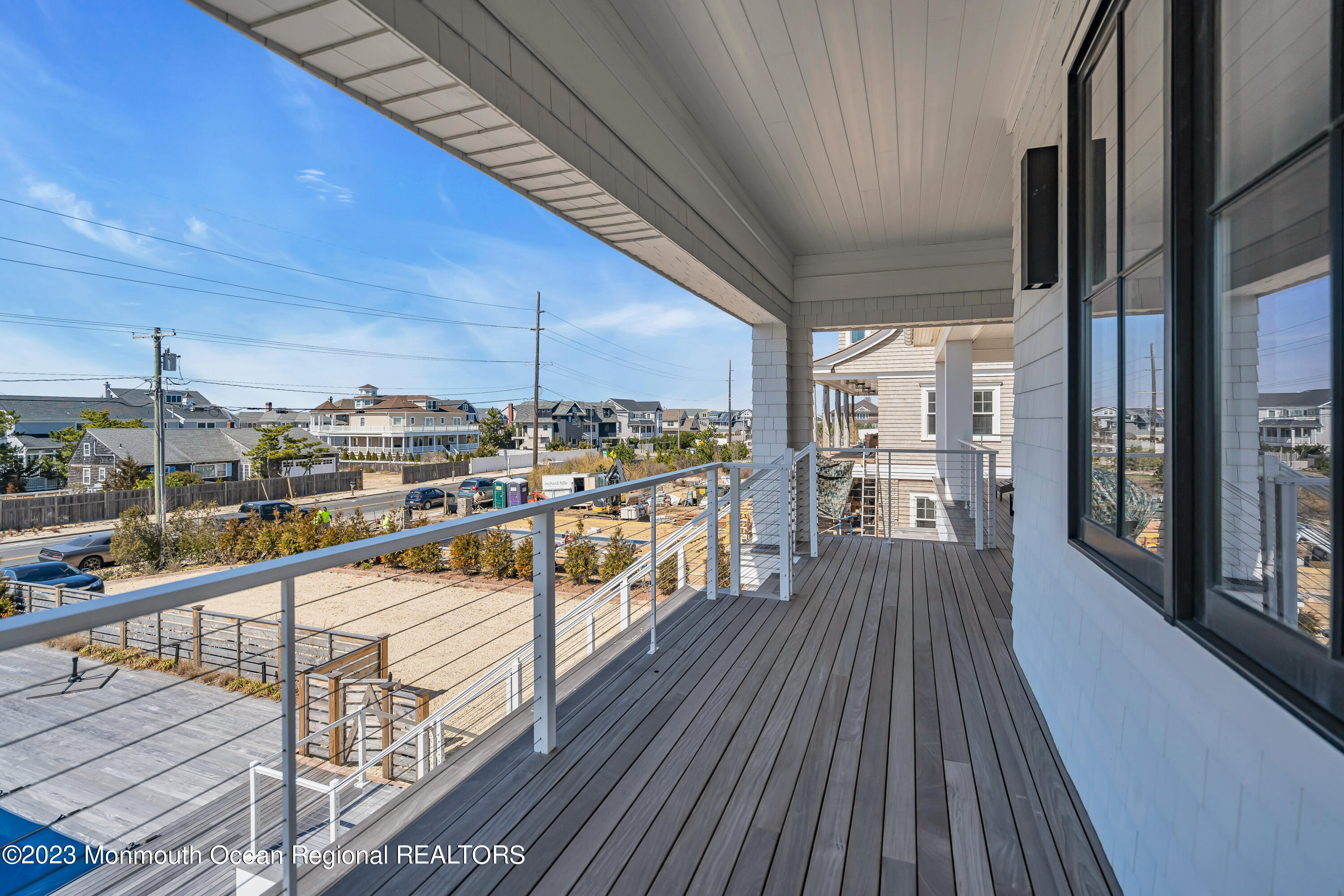 1125 North Ocean Avenue Mantoloking, NJ 08738 - Photo 7 of 69 a view of a balcony with wooden floor