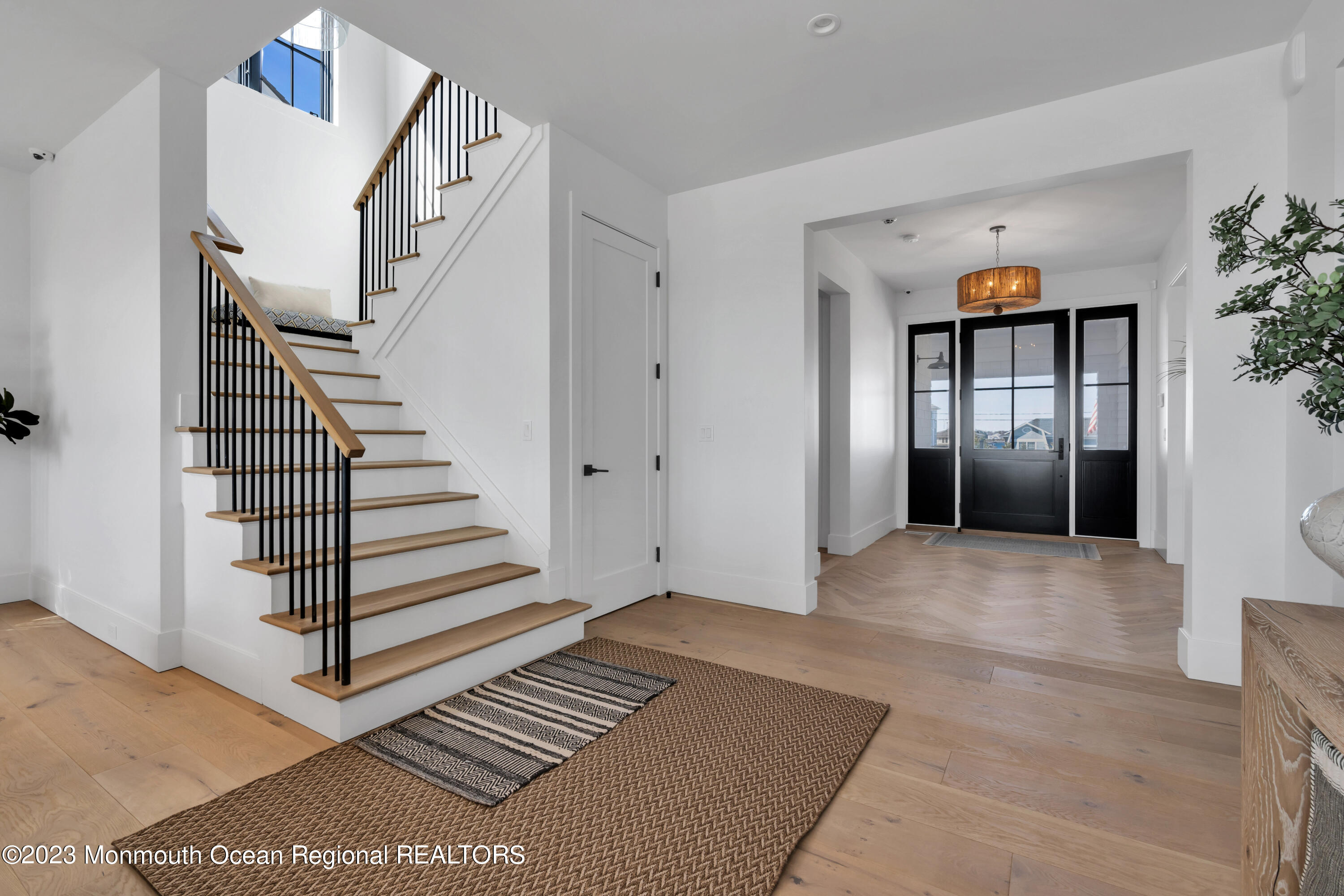 1125 North Ocean Avenue Mantoloking, NJ 08738 - Photo 9 of 69 a view of entryway with wooden floor and stairs