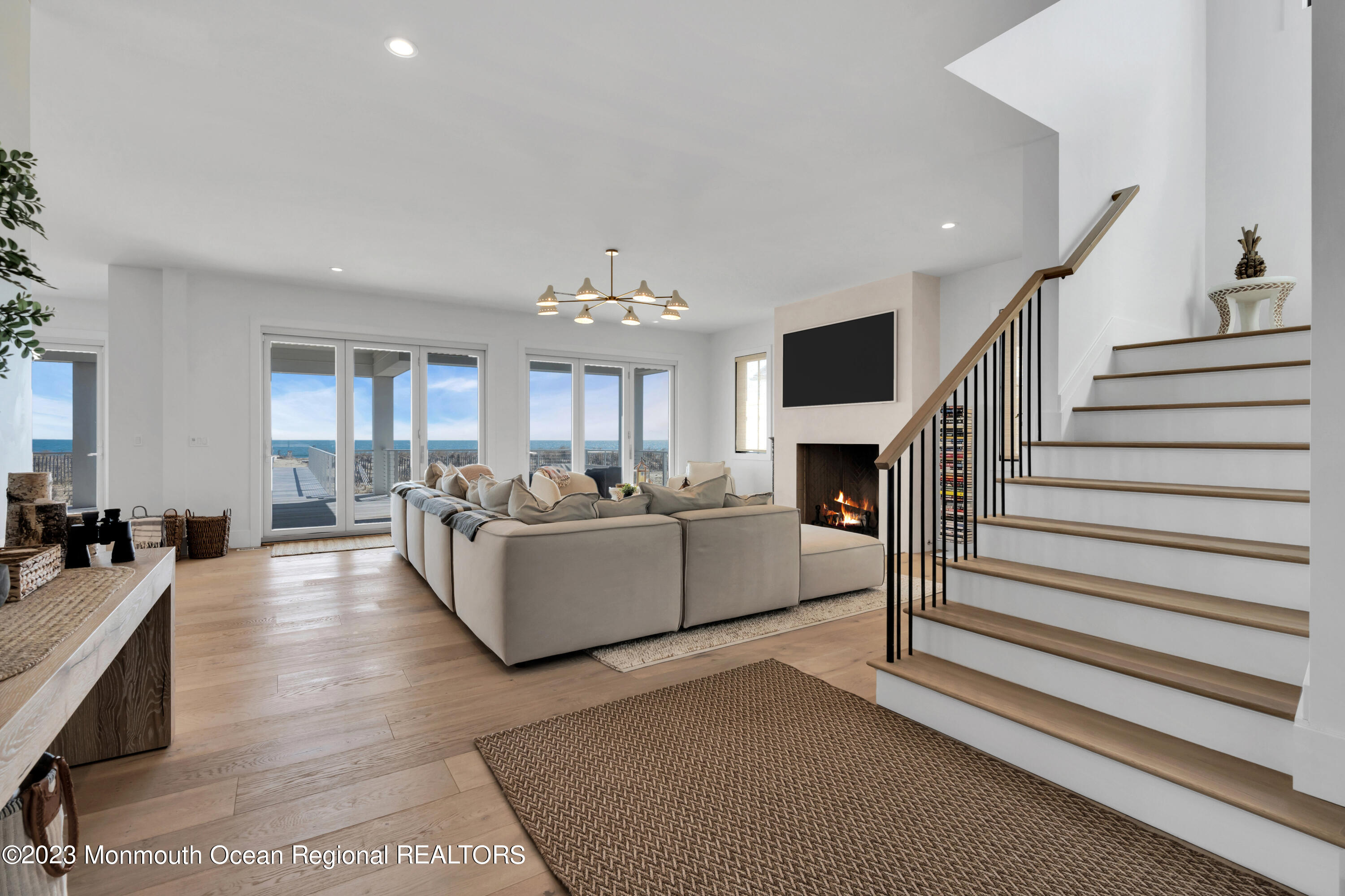1125 North Ocean Avenue Mantoloking, NJ 08738 - Photo 10 of 69 a living room with furniture and a fireplace
