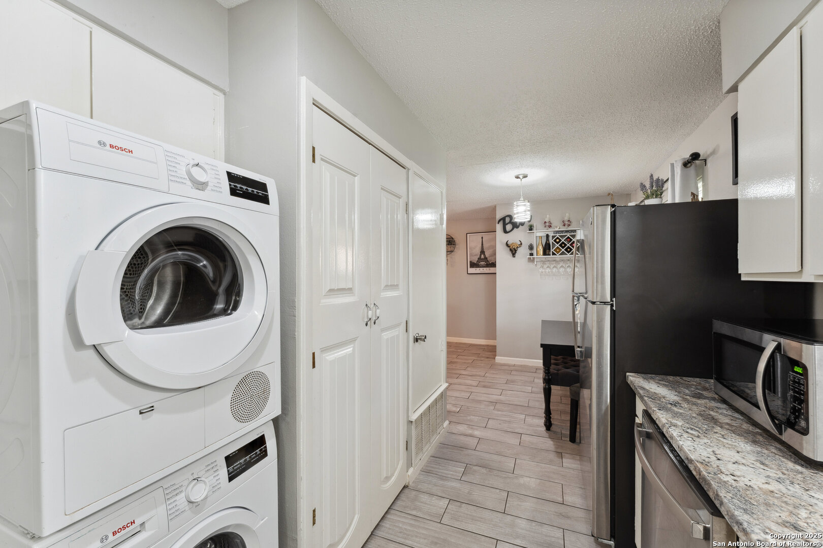 923 Vance Jackson Road, Unit 1104 San Antonio, TX 78201 - Photo 11 of 18 a kitchen with a refrigerator sink and cabinets