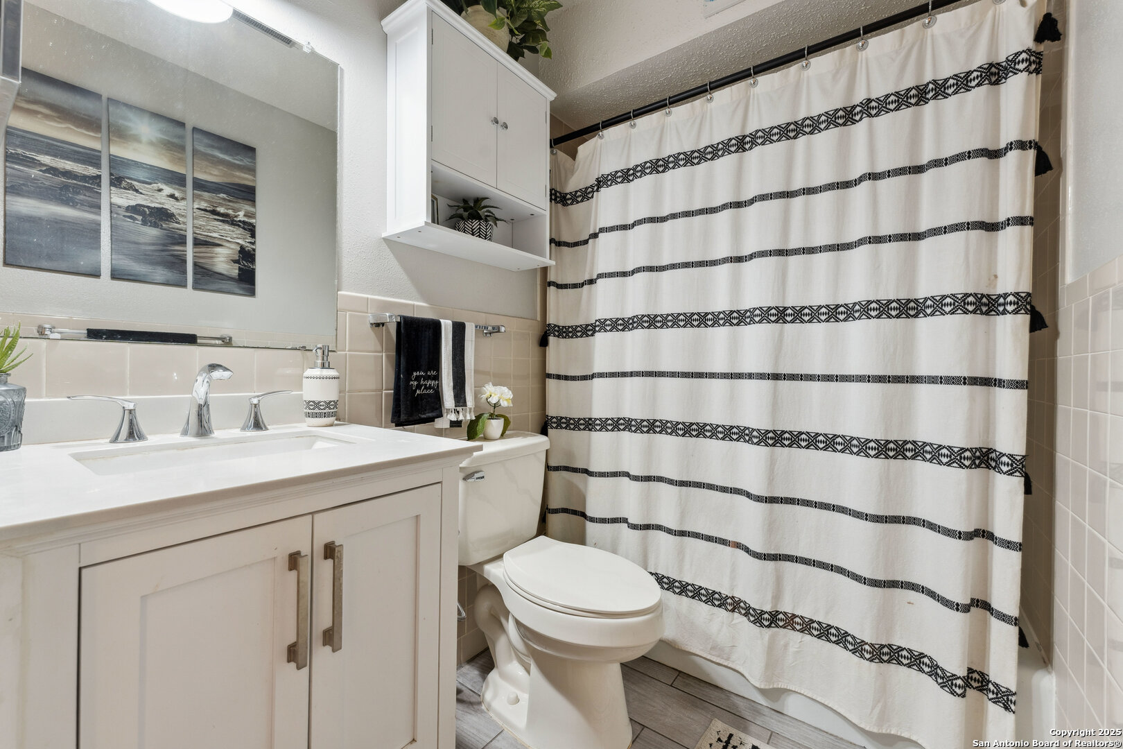 923 Vance Jackson Road, Unit 1104 San Antonio, TX 78201 - Photo 14 of 18 a bathroom with a sink toilet and shower