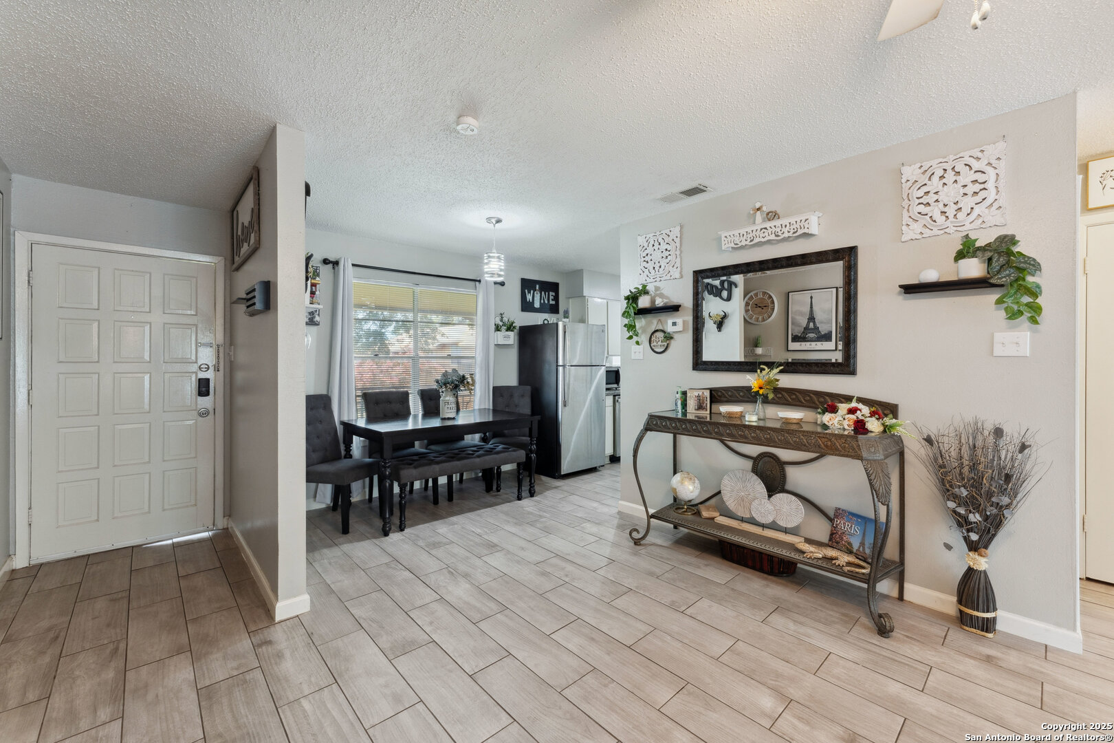 923 Vance Jackson Road, Unit 1104 San Antonio, TX 78201 - Photo 5 of 18 a bedroom with furniture and a mirror