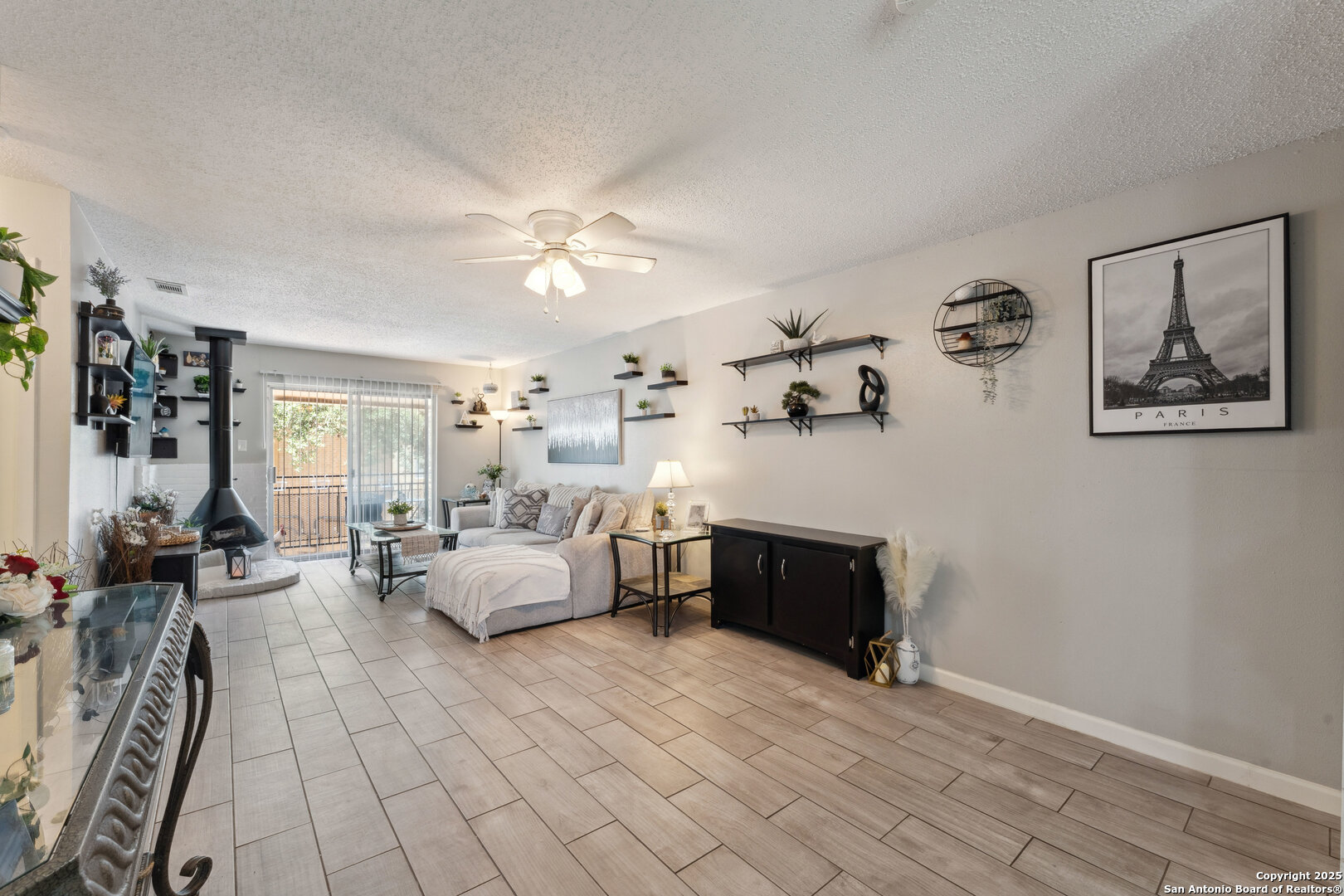923 Vance Jackson Road, Unit 1104 San Antonio, TX 78201 - Photo 6 of 18 a living room with furniture and wooden floor